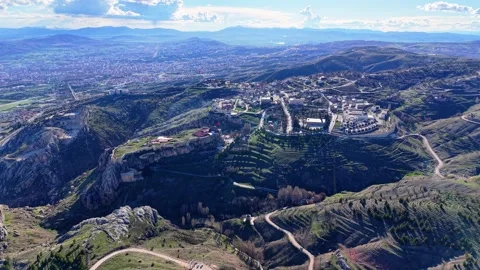 Cinematic Aerial Pullback from Historic Castle with Vast City View Stock Footage 342239086