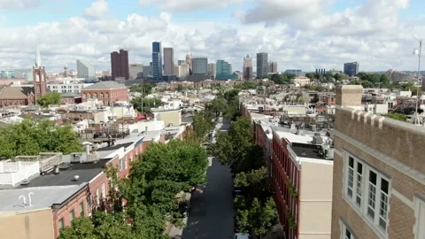 Cinematic aerial pullback reveals expanse of Baltimore skyline from Stock Footage 141138429