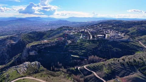 Cinematic Aerial Rise Looking Down Over Historic Castle and Vast City Stock Footage 342236482