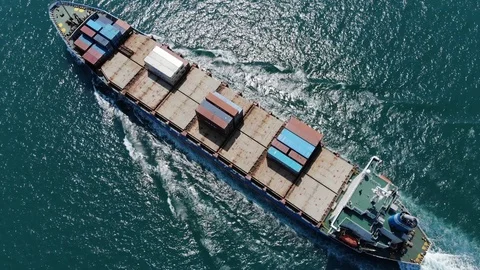 Cinematic aerial shot of rather empty container ship during return trip Stock Footage 91699462