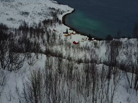 Cinematic Aerial Tilt of houses on the coast of a fjord in Tromso Stock Footage