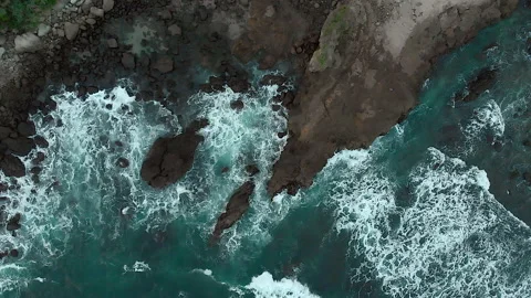 Cinematic aerial top down view of rock shoreline Stock Footage 147429678