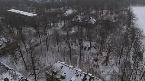 Cinematic Aerial View of an Abandoned Soviet Barracks in Winter, Germany Stock Footage 328732536