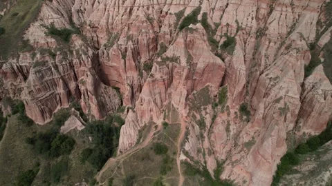 Cinematic aerial view down on the Rapa Rosie Canyon in Romania. Orbiting around Stock-Footage 309857428