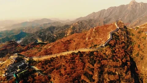 Cinematic aerial view of the Great Wall of China during golden hour. Video stock 342820232