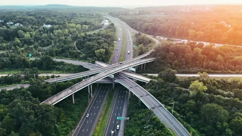 Cinematic aerial view of a highway interchange with light... Видео 340657941