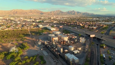 Cinematic Aerial View of Industrial Processing Plant Near Highway Stock Footage 334952503