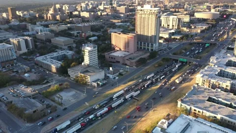 Cinematic aerial view over traffic during 5 pm rush hour in downtown corridor Stock Footage 146080319