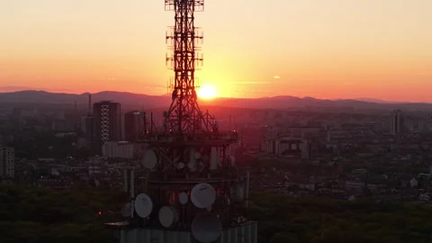 Cinematic aerial view of Sofia, Bulgaria during a glowing sunset. The iconic TV 스톡 동영상 309273471