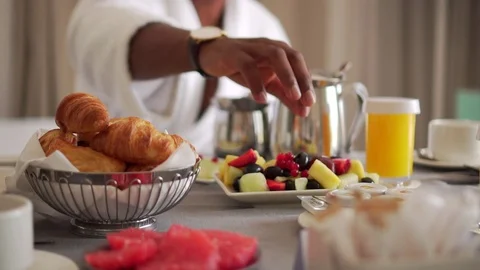 Cinematic African American Man Eating Fruit At Breakfast In Hotel Room Stock Footage