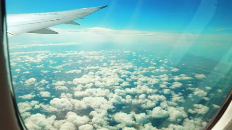 Cinematic Airplane Wing View Flying Through the Clouds Stock Footage 340561097
