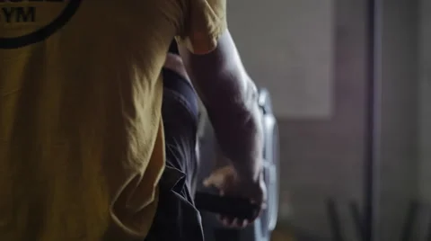 Cinematic angle of man on rowing machine Stock Footage 42235716