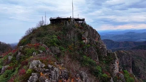 Cinematic Autumn Drone Through Sharp Rocks to Terrace | 4K 60fps Stock Footage 335068784
