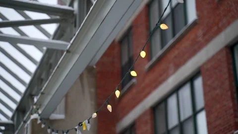 Cinematic b-roll footage of string lights hang during winter season. Stock Footage 102615259