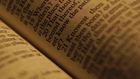 Cinematic Bible Open With Text, 4K Stock Footage 150403173