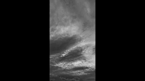 Cinematic black/white drone hyperlapse of large clouds drifting Stock Footage 317918894