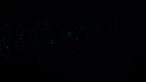 Cinematic Blue Dust Particles Floating on Black Background Stock Footage 340522966