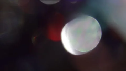 Cinematic bokeh light leak on black background. Vídeo Stock 309599014