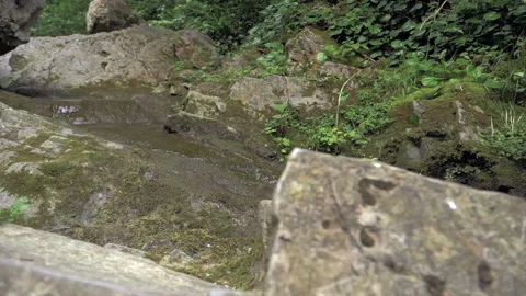 Cinematic camera movement over the rocks. Camera moves smoothly to the stream Stock Footage 154222260