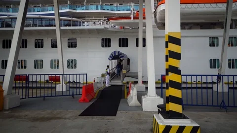 Cinematic camera movement on seaport long passage dock to the cruise ship Stock Footage 111278014