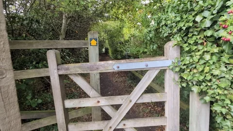 Cinematic Camera Moving Through Traditional English Wooden Gate Video stock 315916282