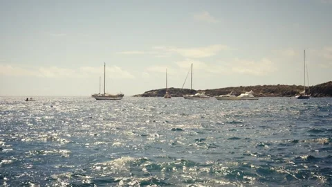 Cinematic Camera Shot of Small Bay with Boats and Splashing Waves, Tenerife Stock Footage 316903611