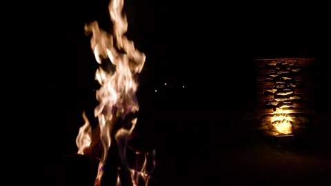 Cinematic campfire burning in the dark with stone wall background Stock Footage 327636919