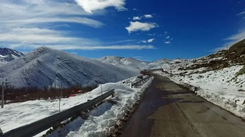 Cinematic car mounted perspective of a winding solitary, stock footage. Stock Footage 304935284