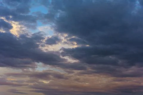 Cinematic cityscape at sunset with dramatic clouds Stock Photos