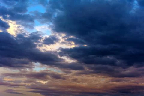 Cinematic cityscape at sunset with dramatic clouds Stock Photos