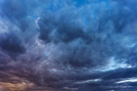 Cinematic cityscape at sunset with dramatic clouds Stock Photos