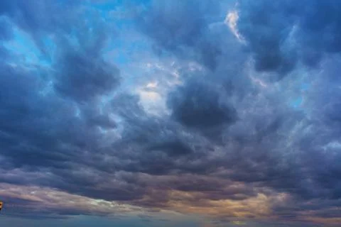 Cinematic cityscape at sunset with dramatic clouds Stock Photos