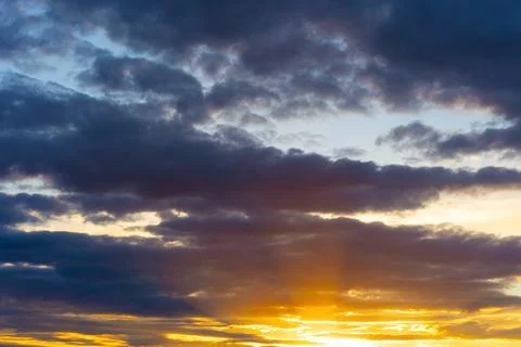 Cinematic cityscape at sunset with dramatic clouds Stock Photos
