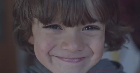 Cinematic close-up of 4-year-old Caucasian boy smiling at 4k camera. Slow Motion Stock Footage 231762688