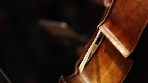 Cinematic close up of cello bowing on stage Stock Footage 331679237