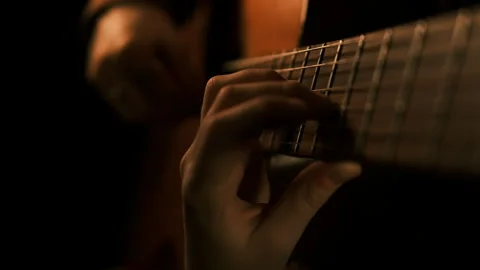Cinematic. Close up classic guitar strings, girls hands Stock Footage 292666803