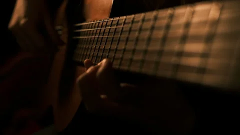 Cinematic close up of a classical guitar. Skilled hands play Stock Footage 324247843