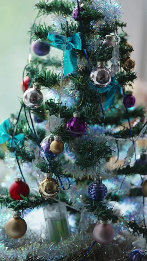Cinematic close-up of decorated Christmas tree with shimmering glass ornamen Stock Footage 337122464