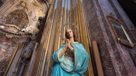 Cinematic Close-Up Of A Devotional Statue Of The Virgin Mary In A Blue Robe Stock Footage 334972970