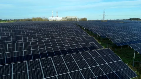 Cinematic close flying pass solar panels, renewable power production net zero UK Stock Footage 324857450