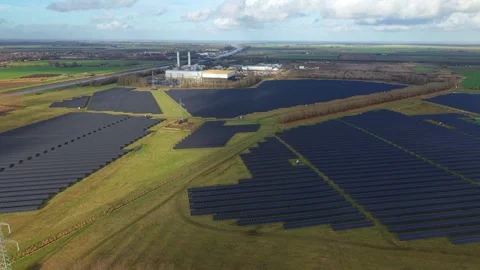 Cinematic close flying pass solar panels, renewable power production net zero UK Stock Footage 328293081