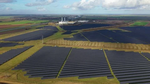 Cinematic close flying pass solar panels, renewable power production net zero UK Stock Footage 328293088