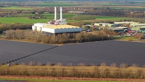 Cinematic close flying pass solar panels, renewable power production net zero UK Stock Footage 328293120