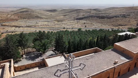 Cinematic Close Flyover of Saffron Monastery with Olive Trees and Desert Stock-Footage 336986936