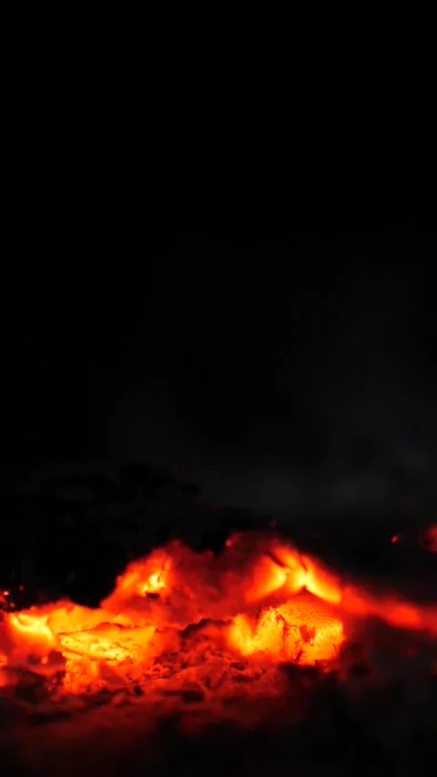 Cinematic Close-Up of Glowing Red Embers and Burning Charcoal and Flying Ashes Stock Footage 326665975