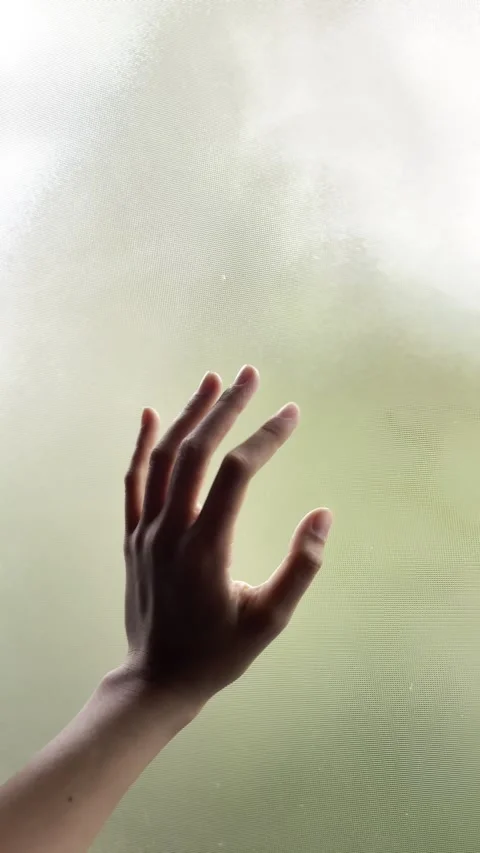 Cinematic Close-up of Hand Gently Touching Frosted Glass Stock Footage 339119064