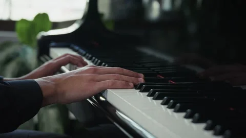 Cinematic Close-Up of Hands Playing Grand Piano with Background Window Light Stock Footage 284482748