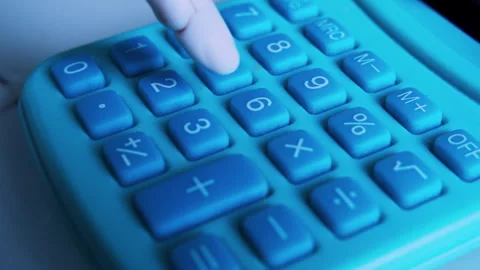 Cinematic close up of humanoid robot finger pressing buttons on calculator Stock Footage 337912337