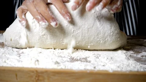 Cinematic close up kneading dough on table by professional artisan baker ba.. Stock Footage 272466757
