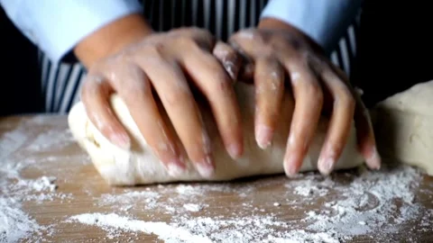 Cinematic close up kneading dough on table by professional artisan baker ba.. Stock Footage 272466775